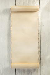 parchment scroll on wood