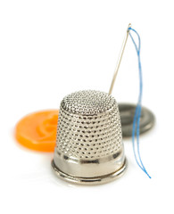 sewing thimble and thread with needle