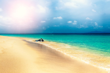 Fototapeta na wymiar Tropical beach with clouds