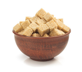 brown sugar cubes in bowl on white