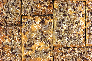 ruddy cookie with sesame seeds and sunflower closeup. homemade b