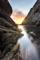 Between the cliff wating the sunset