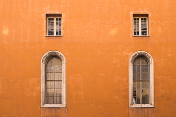 Orange facade of a house in Rome, Italy