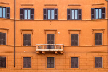 Orange facade of a house in Rome, Italy