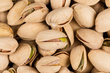 Pistachio nuts arranges as background