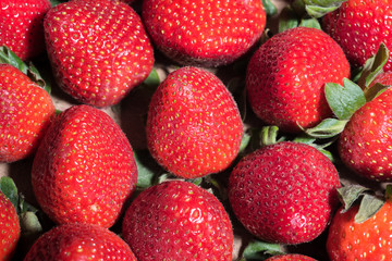 fresh tasty, ripe strawberries with green leafs