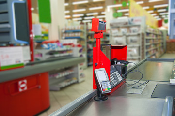 Cash desk with payment terminal in supermarket
