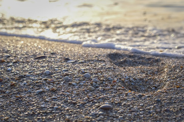 Fototapeta na wymiar Footprint on the sea beach