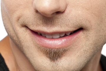 man's smiling lips