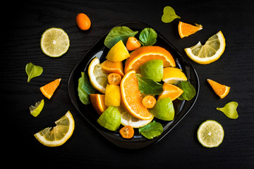 citrus salad on black background