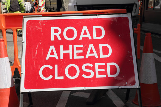 CAMBRIDGE, UK - APRIL 17, 2016:  Continuing development in the city is causing road closures and diversions as illustrated by this 'Road Ahead Closed' sign - Illustrative Editorial