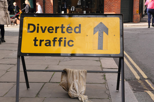 CAMBRIDGE, UK - APRIL 17, 2016:  Continuing development in the city is causing road closures and diversions as illustrated by this 'Diverted Traffic' sign - Illustrative Editorial