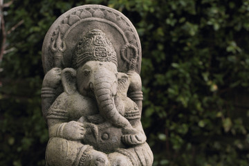 Fototapeta na wymiar Hindu god lord Ganesh or Ganesha also known as Ganapati or Vinayaka depicted in a weathered garden ornament