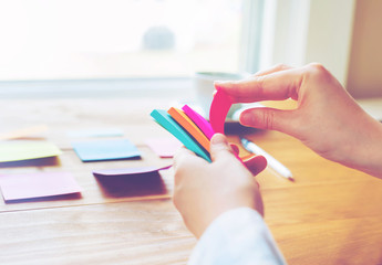 Person organizing things at a desk