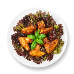 Fried roasted chicken wings on lettuce