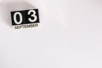 September 3rd. Image of september 3 wooden table calendar on white background. Autumn day. Empty space for text