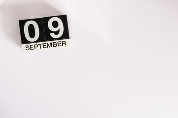September 9th. Image of september 9 wooden table calendar on white background. Autumn day. Empty space for text. International Beauty Day