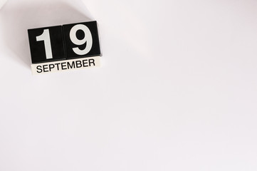 September 19th. Image of september 19 wooden desk calendar on white background. Autumn day. Empty space for text. International Talk Like A Pirate Day