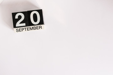 September 20th. Image of september 20 wooden table calendar on white background. Autumn day. Empty space for text