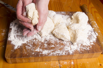 Making dough by female hands