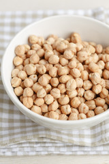 Dried chickpeas in a white bowl