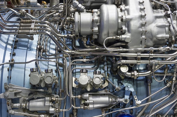 Obraz premium Jet engine, internal structure with hydraulic, fuel pipes and other hardware and equipment, aviation, aircraft and aerospace industry 