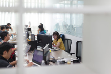 Asian Software Developers Office Team Sitting At Desk