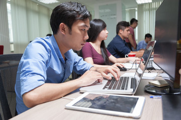 Asian Businessman Sitting At Desk Working Laptop Computer Busine