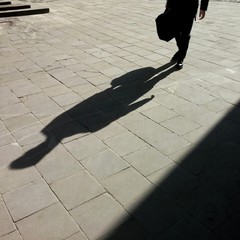Shadow of the man with bag