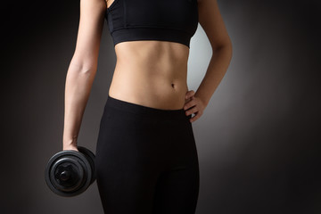 female torso with dumbell