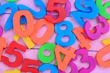 Many colorful numbers on purple table