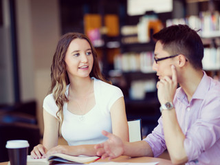 Two young students at the library