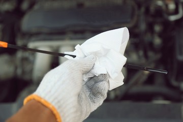 hand holding car repair tools in garage