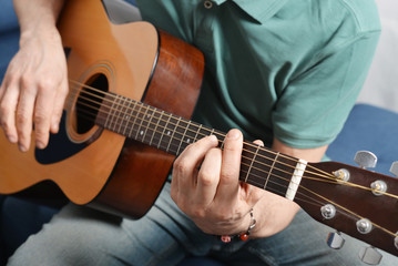 Fototapeta na wymiar fingers from playing acoustic guitar