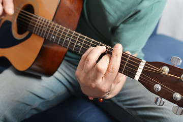 Fototapeta na wymiar Fingers from playing acoustic guitar