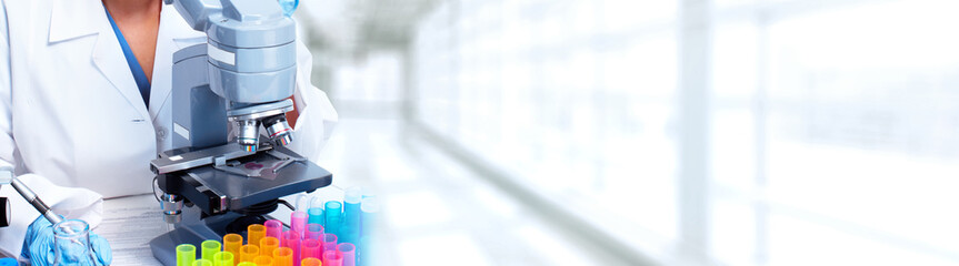 Doctor woman  working with a microscope.