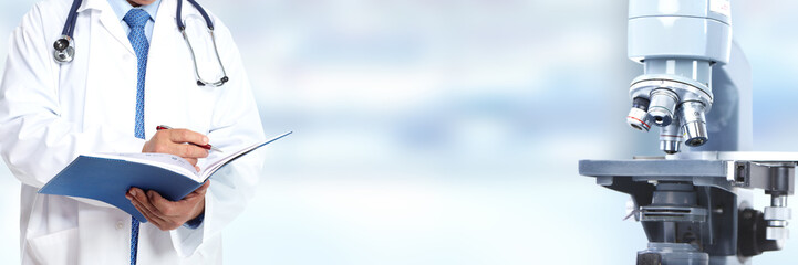 Doctor hands and microscope.