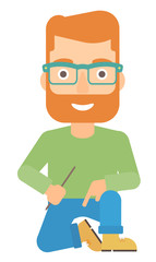 Smiling man sitting.