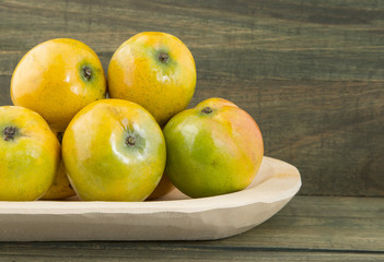 Mango tropical fruit on a wooden background