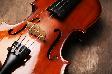 Fototapeta premium Violin on wooden background
