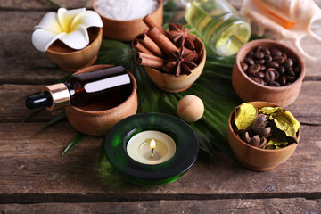 Beautiful spa setting on palm leaf on wooden table
