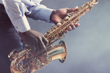 Obraz premium African American jazz musician playing the saxophone, closeup