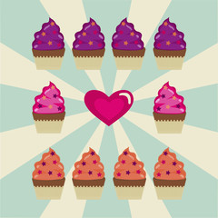 some cupcakes and a heart on a white and blue background