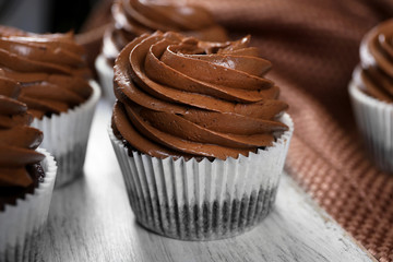 Chocolate cupcakes on light table, close up