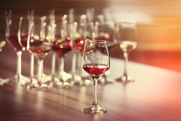 Glass of red wine on a table, close up