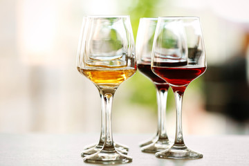 Many glasses of different wine on a table