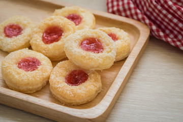 Obraz na płótnie Canvas Puff pastry cookies filled with jam