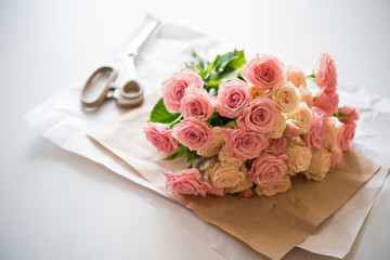bouquet of fresh roses and scissors