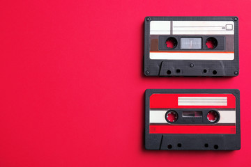 Old audio cassettes on red background