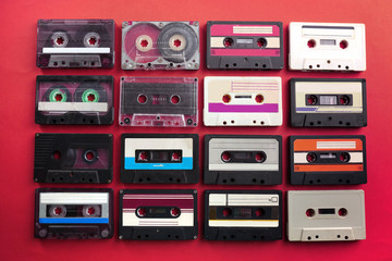 Fototapeta premium Set of old audio cassettes on red background